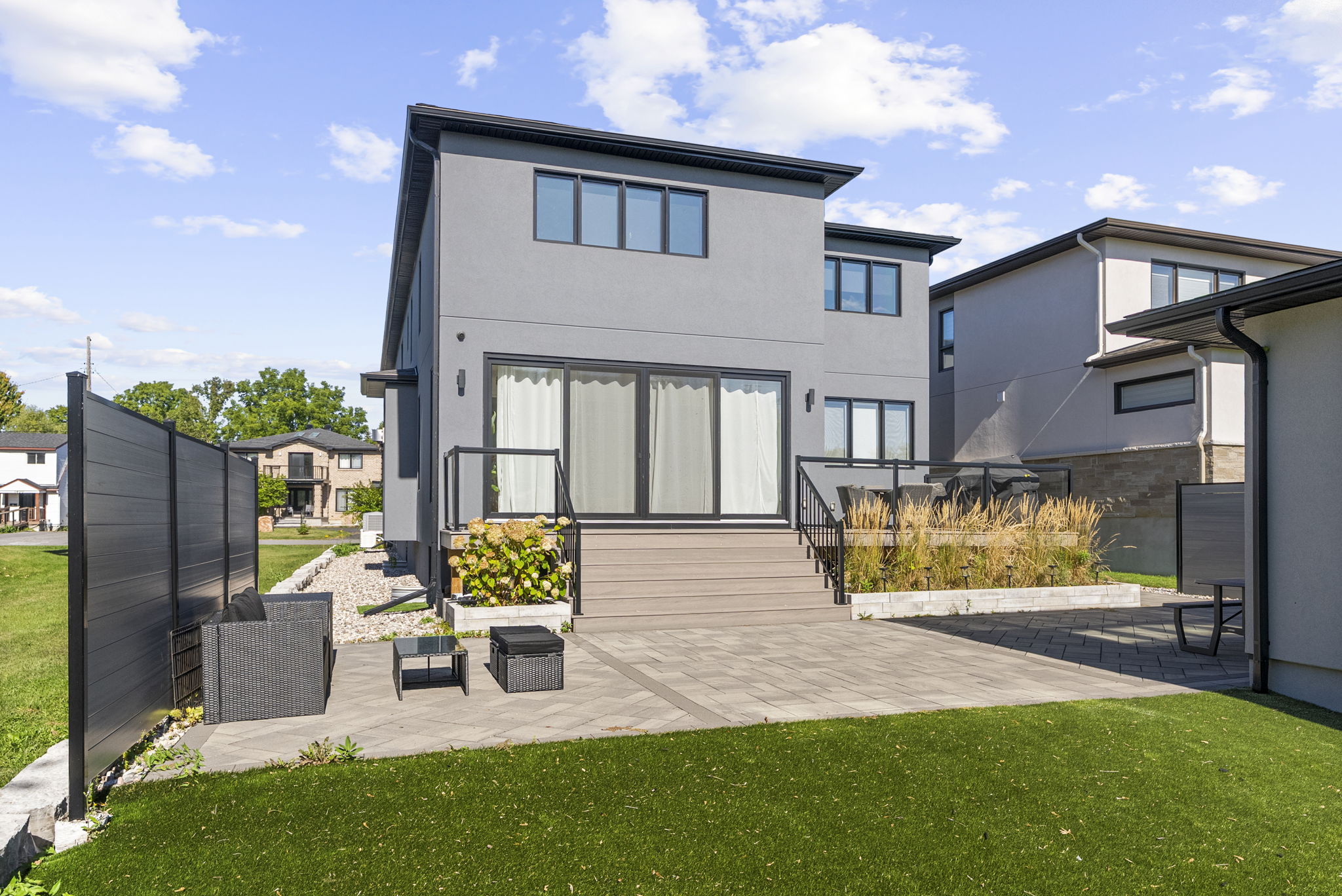 Main view of Modern Backyard Patio and Turf Courtyard.
