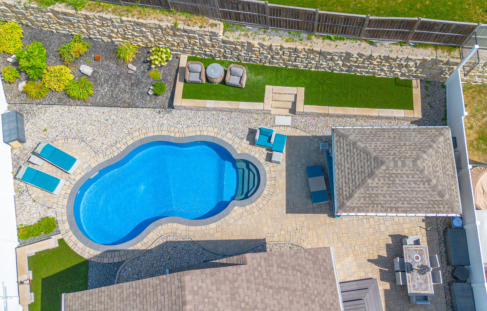 Main view of Poolscape with Timber Cabana and Retaining Wall.